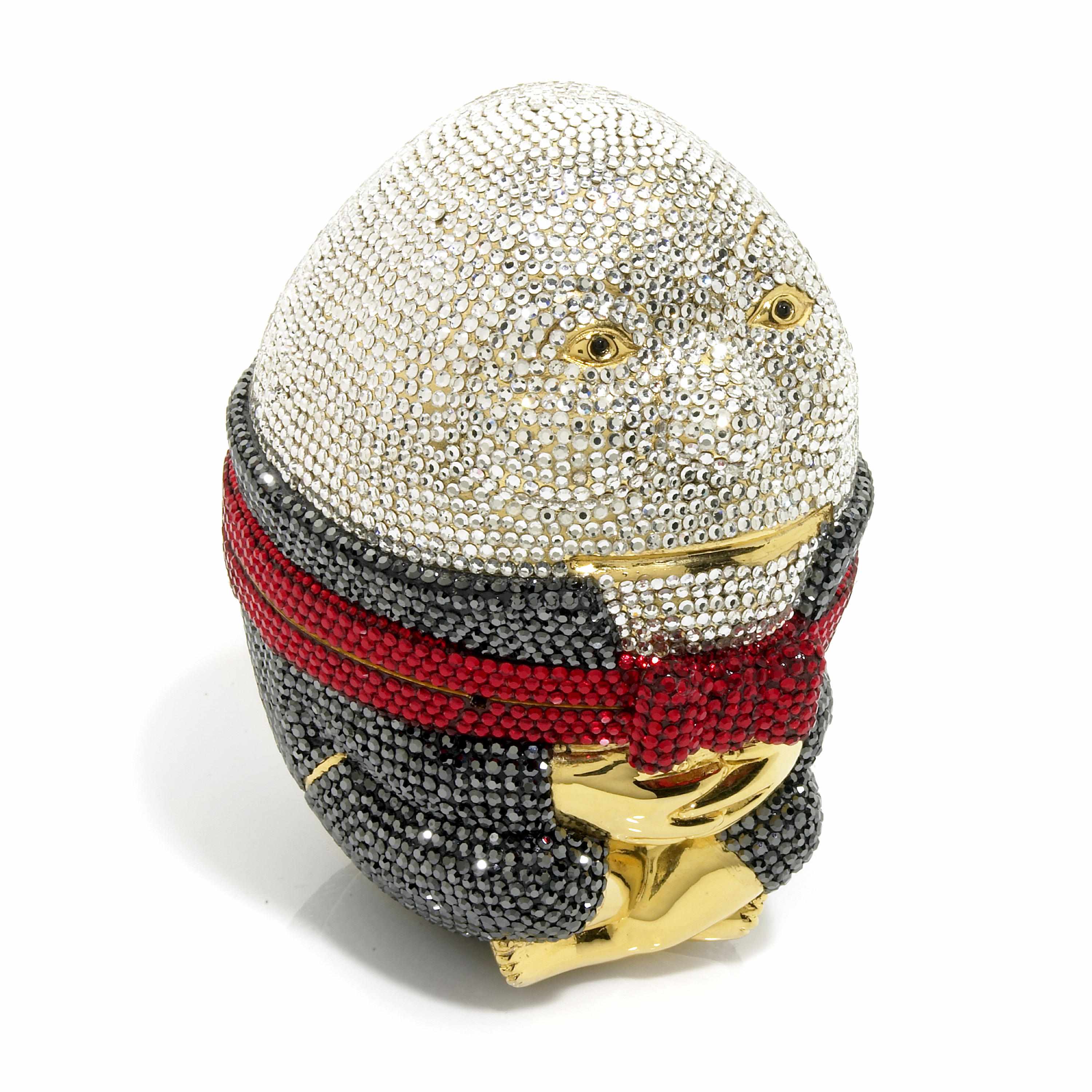 Appraisal: A dark blue silver and red humpty dumpty minaudiere interior