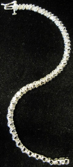 Appraisal: karat white gold diamond bracelet 'X' form links accented by