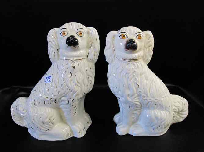 Appraisal: PAIR ENGLISH STAFFORDSHIRE PORCELAIN DOGS in opposing positions each with