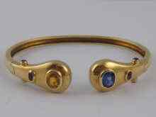 Appraisal: A yellow metal tests ct gold bangle set with blue