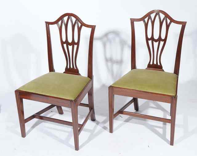 Appraisal: A PAIR OF HEPPLEWHITE STYLE DINING CHAIRS with green upholstered