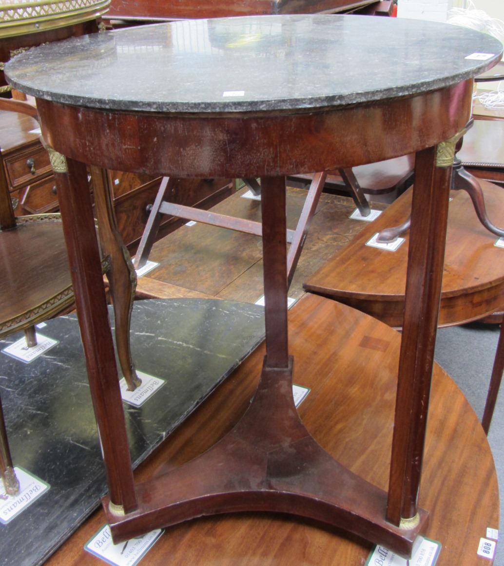 Appraisal: An Empire gilt metal mounted marble top mahogany gueridon on