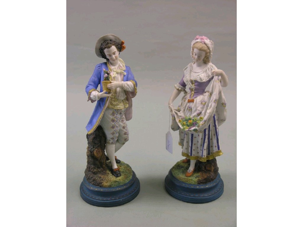 Appraisal: A pair of th century French bisque porcelain statuettes young