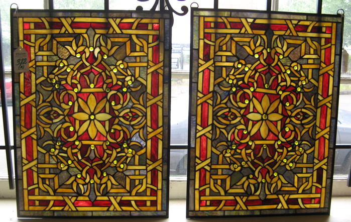 Appraisal: PAIR STAINED AND LEADED GLASS WINDOW PANELS the field and