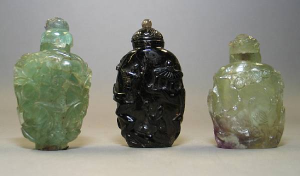 Appraisal: Three hardstone snuff bottles Including two of fluorite both carved