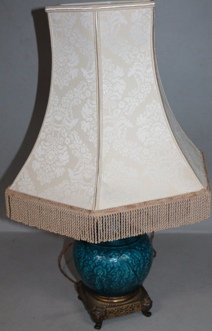 Appraisal: An oriental table lamp with turquoise earthenware bottle stem and