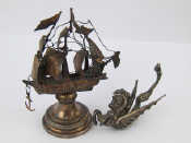 Appraisal: A miniature silver nef complete with anchor and jolly boat