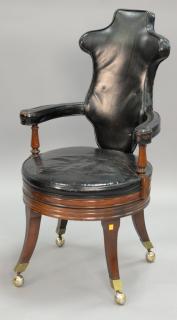 Appraisal: Continental style leather swivel office chair on mahogany base Continental