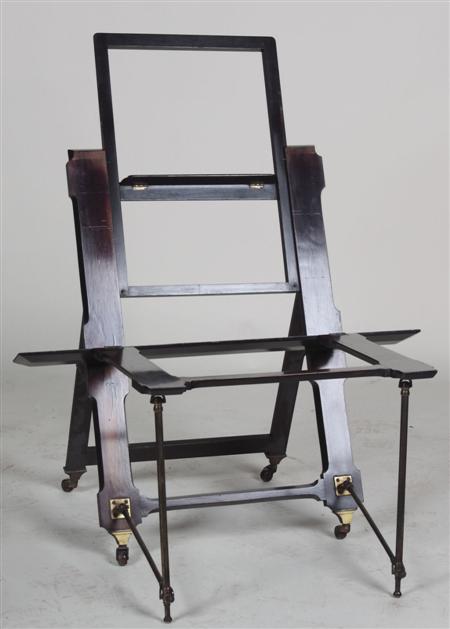 Appraisal: A Victorian rosewood easel the chamfered adjustable frame with extending