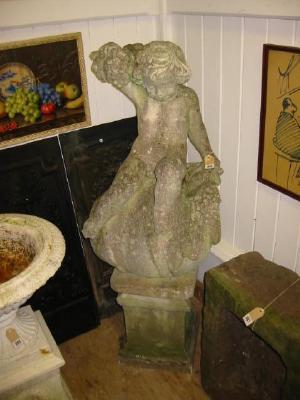 Appraisal: A COMPOSITION STONE FIGURE OF A BACCHANAL modelled as a