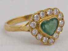 Appraisal: An carat gold diamond and emerald ring the heart shaped