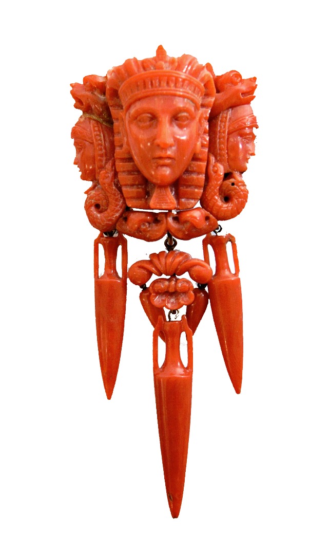 Appraisal: A carved coral brooch designed as a classical mask in