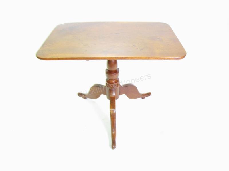 Appraisal: An antique mahogany tilt-top table having tripod curved-leg base x