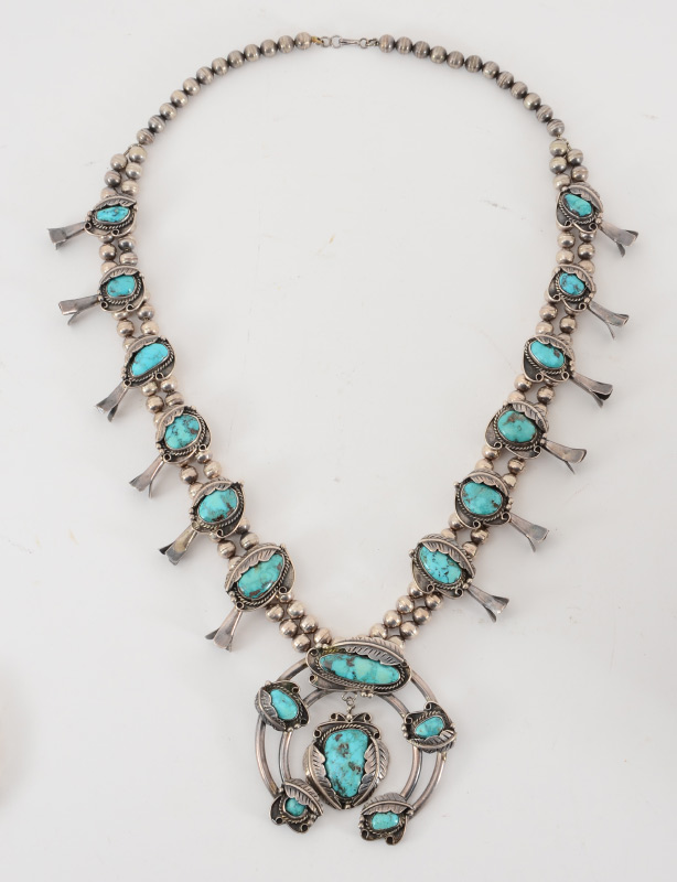 Appraisal: NATIVE AMERICAN SQUASH BLOSSOM NECKLACE Twelve blossoms in graduated size