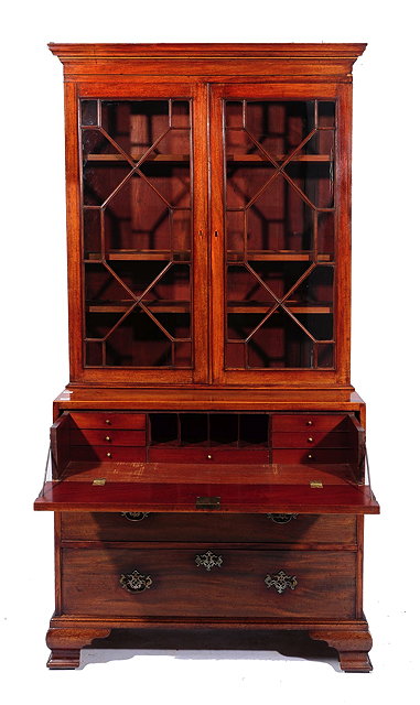 Appraisal: A GEORGE III MAHOGANY SECRETAIRE BOOKCASE the fitted interior enclosed