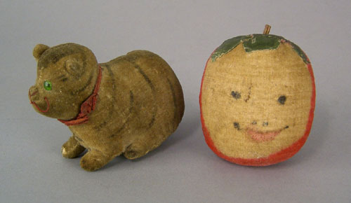 Appraisal: Velvet cat pincushion th c h together with an apple