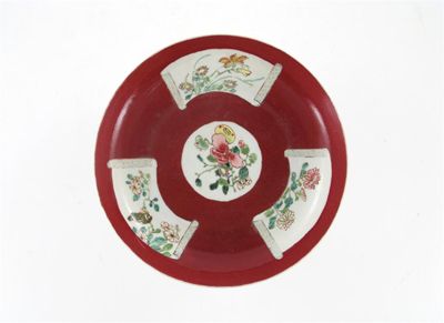 Appraisal: A Chinese ruby ground dish painted with four panels of