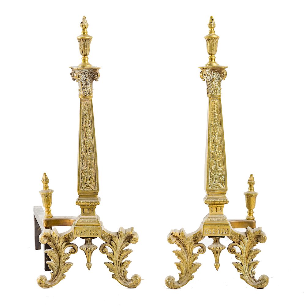 Appraisal: Pair Classical style brass andirons th century urn finials Corinthian