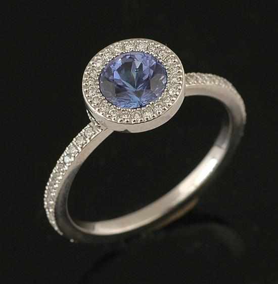 Appraisal: A tanzanite and diamond dress ring Of cluster design centrally