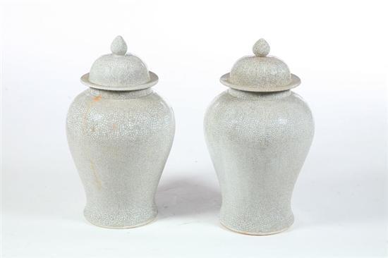 Appraisal: PAIR OF TEMPLE JARS Asian th century ceramic Lidded vases