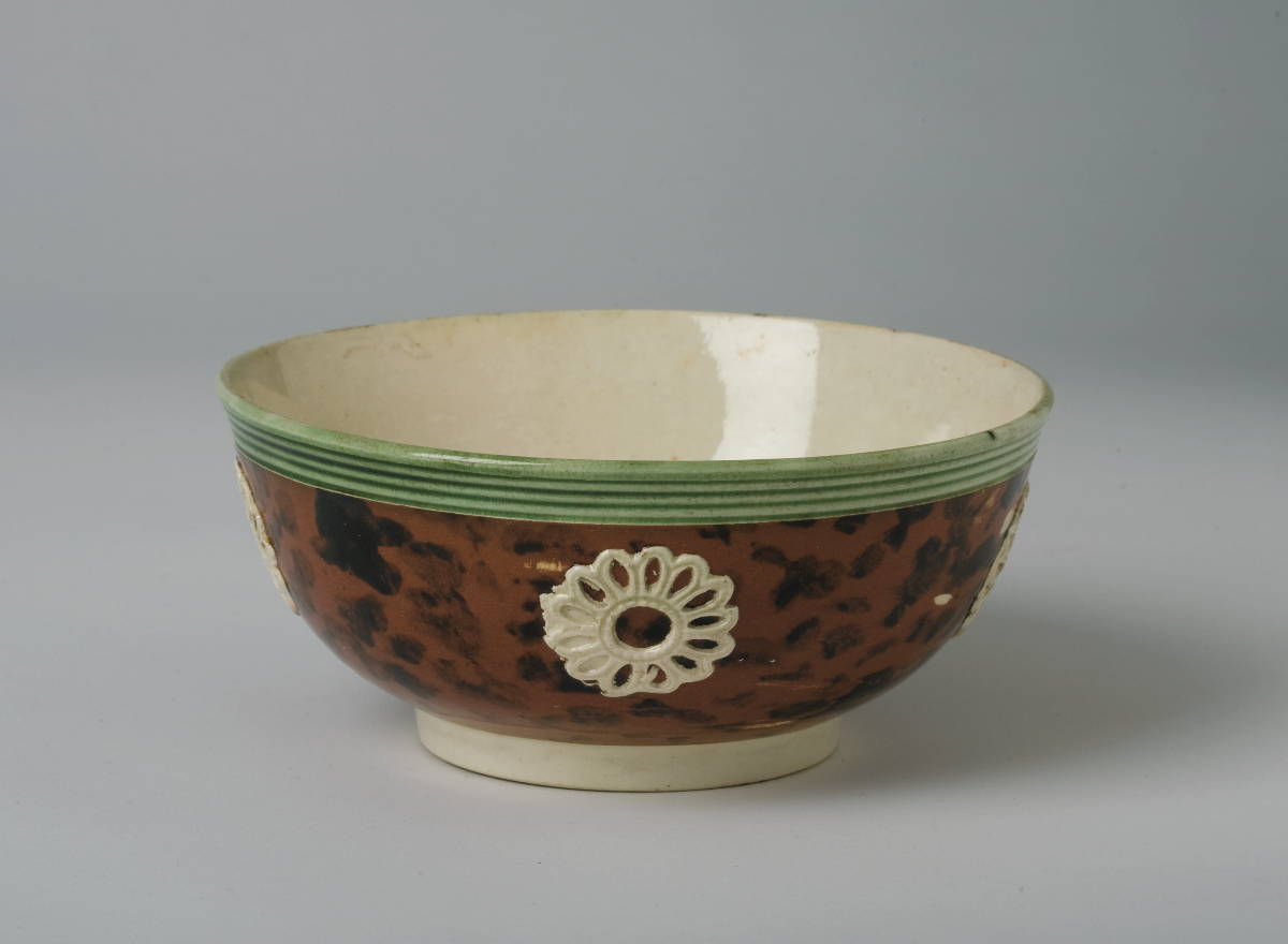 Appraisal: BRITISH CREAMWARE MOCHAWARE HEMISPHERICAL BOWL CIRCA Spotted in black on