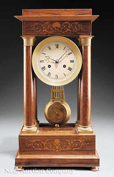 Appraisal: A French Empire Rosewood and Inlaid Portico Clock early th