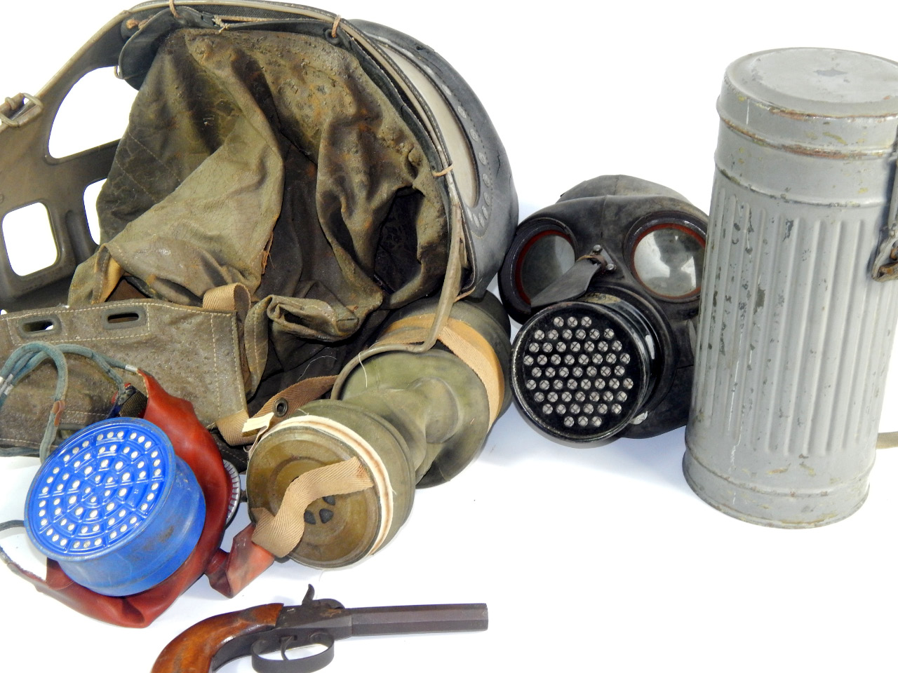 Appraisal: Gas masks a percussion cap pistol and a chemical warfare