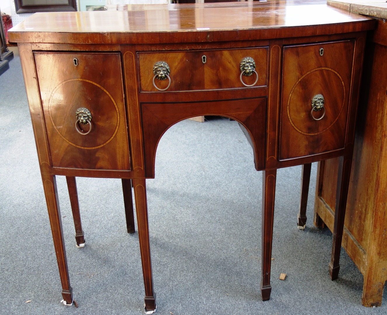 Appraisal: A small th century inlaid mahogany bowfront three drawer sideboard