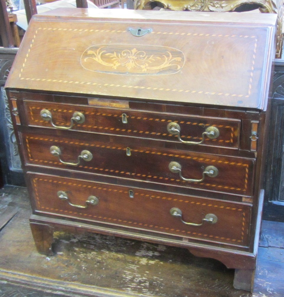 Appraisal: A George III style inlaid mahogany child's bureau the fall