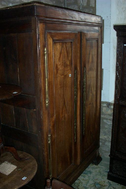 Appraisal: An th century French provisional chestnut armoire enclosed by two