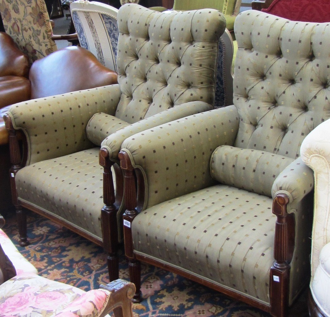 Appraisal: A pair of Edwardian mahogany framed easy armchairs on reeded