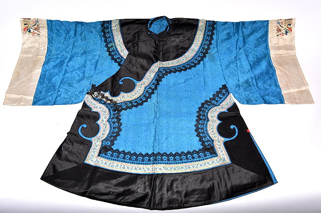 Appraisal: A Chinese blue silk jacketlate th Centurywith embroidered sleeves and