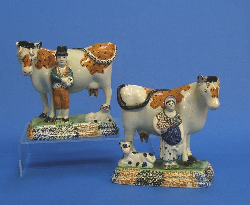 Appraisal: A PAIR OF YORKSHIRE TYPE CREAMWARE COW GROUPS late th