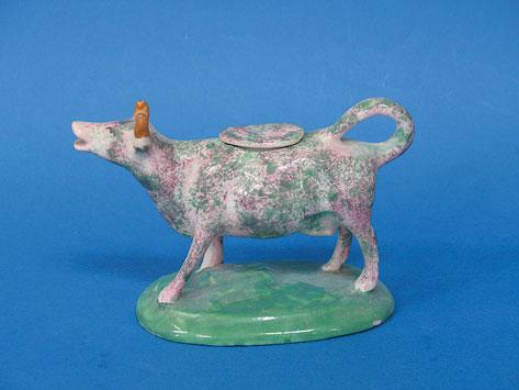 Appraisal: A STAFFORDSHIRE CREAMER in the form of a cow with