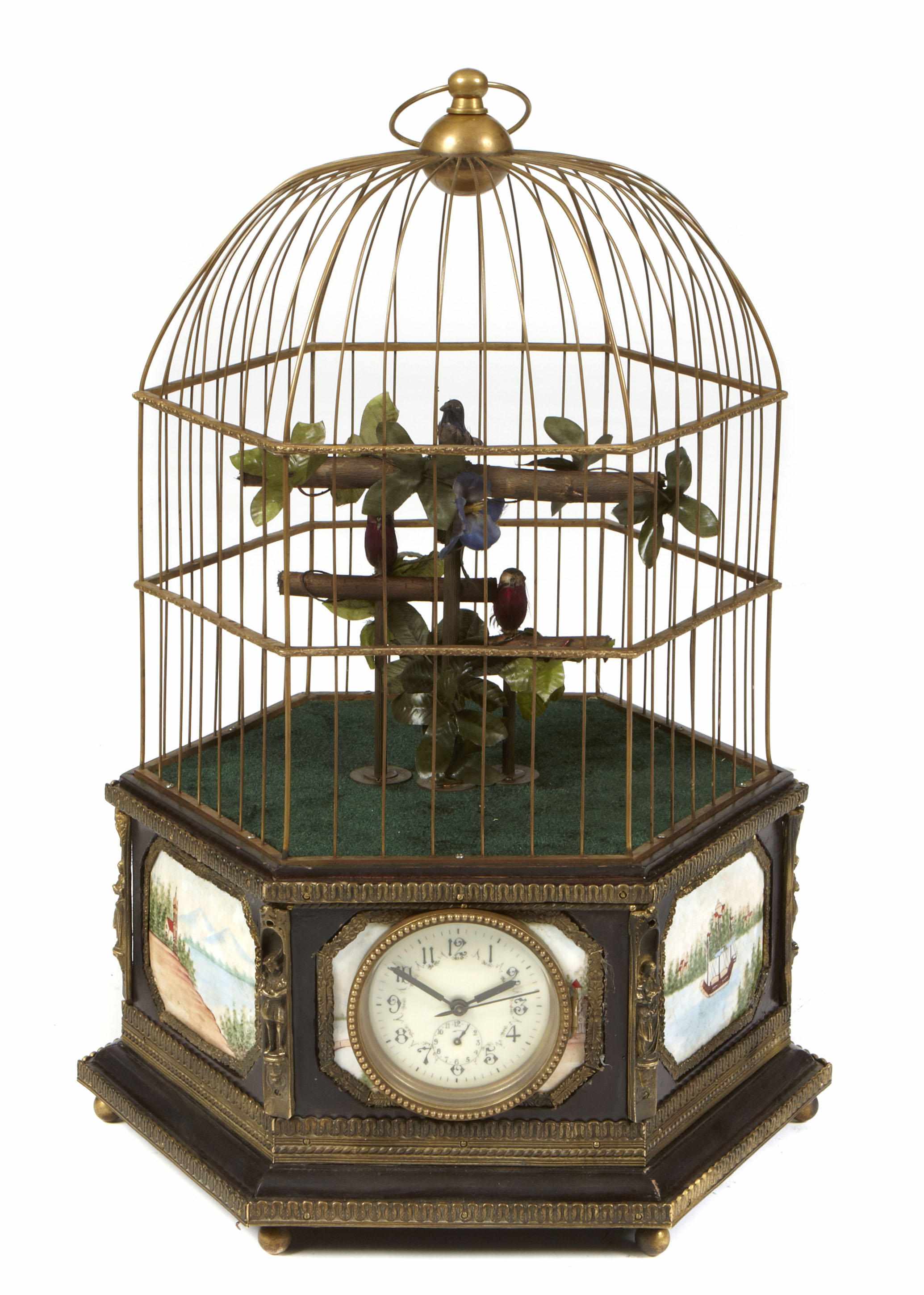 Appraisal: A Swiss style bronze and plaque mounted automaton bird cage