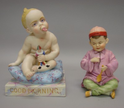 Appraisal: -Piano figurines baby Chinese boy Figure of male baby sitting