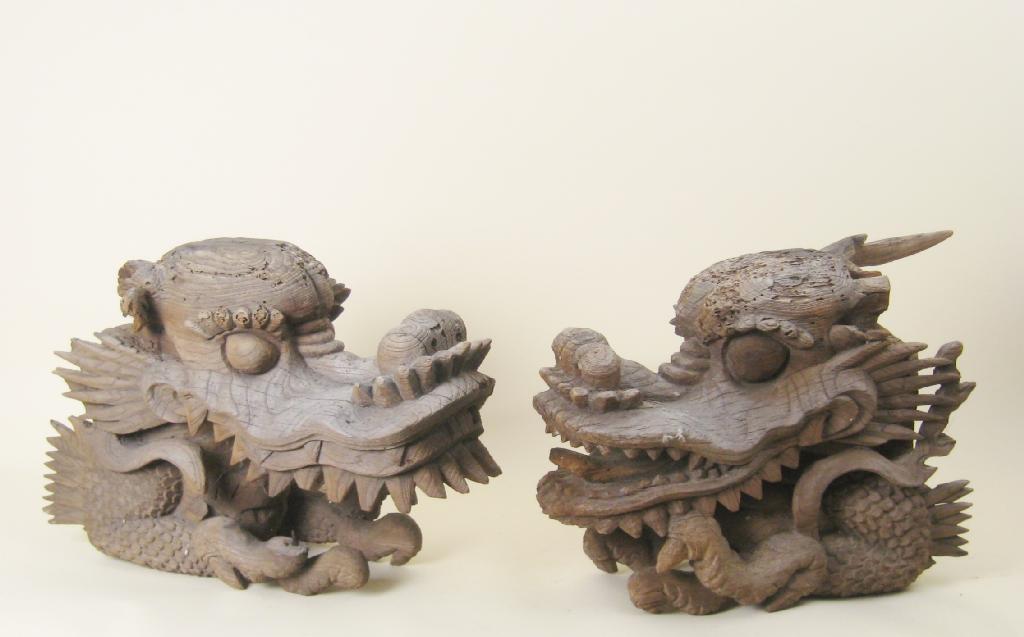 Appraisal: Two early Chinese carved wooden Dragon Heads approx in