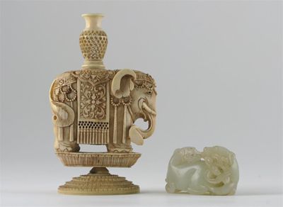 Appraisal: A Chinese pale celadon jade carving of two recumbent dogs