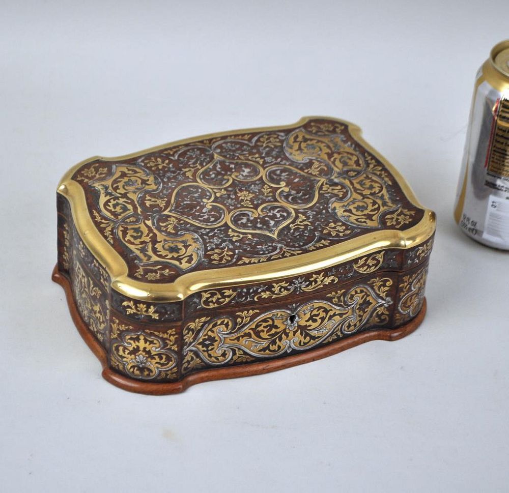 Appraisal: Brass Silver Inlaid Serpentine Lidded Wooden Box wooden construction high