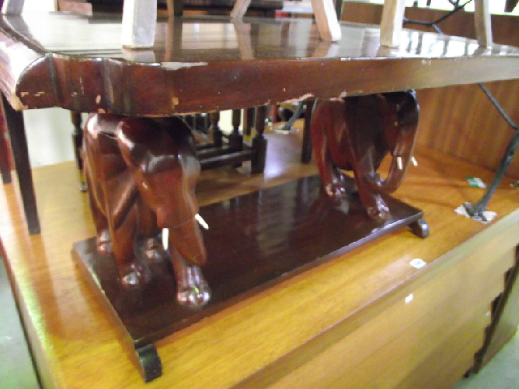 Appraisal: A hardwood occasional table of rectangular form supported by two