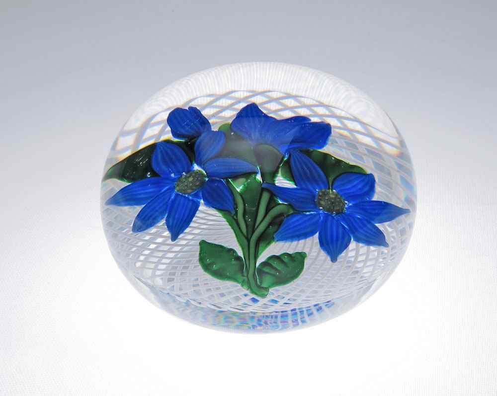 Appraisal: ST LOUIS BLUE FLOWERS IN LATTICE PAPERWEIGHT Latticino ground cane