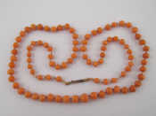 Appraisal: A graduated beaded coral necklace largest bead approx mm