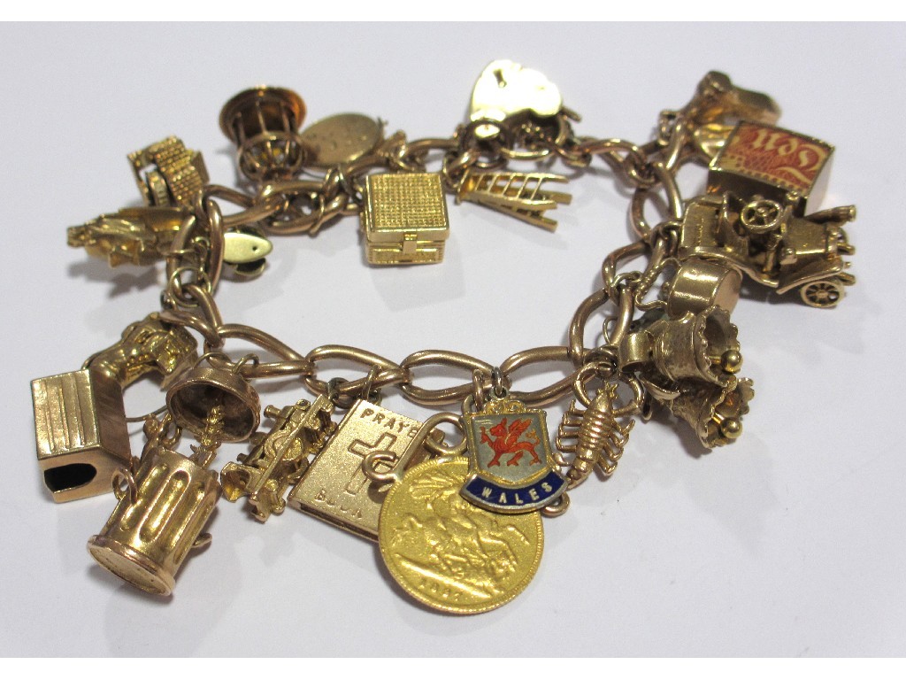 Appraisal: Nine carat gold charm bracelet with various gold charms to