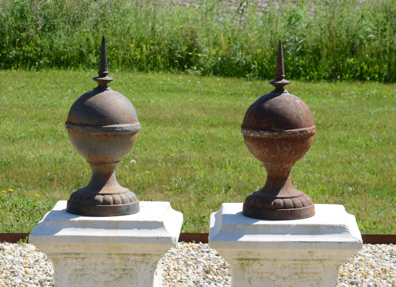 Appraisal: PAIR OF CAST-IRON BALL FINIALS Each orb fitted with a