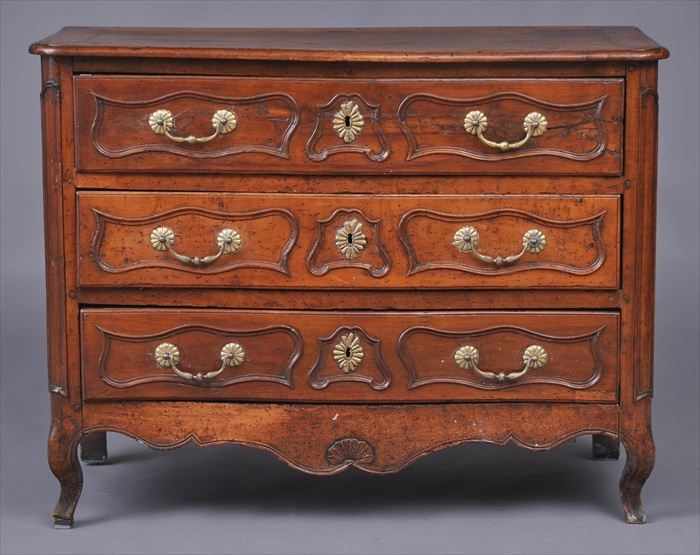 Appraisal: LOUIS XV PROVINCIAL WALNUT SERPENTINE-FRONTED COMMODE The molded top above