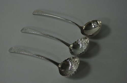 Appraisal: A pair of George III silver sauce ladles IL London