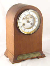 Appraisal: A Victorian dome topped oak cased eight day clock striking