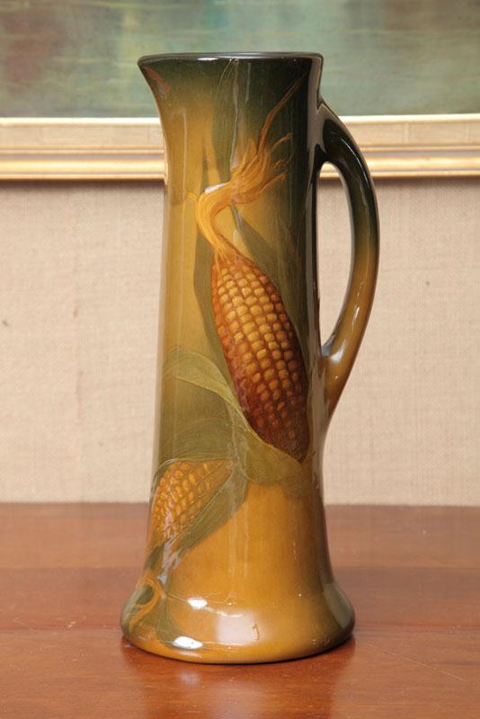 Appraisal: WELLER CORN PITCHER The tall pitcher has a partial mark