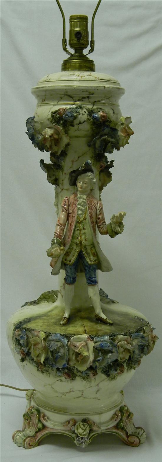 Appraisal: Majolica lamp with a man holding a sword handle painted