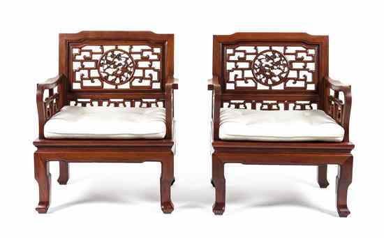 Appraisal: A Pair of Chinese Hardwood Arm Chairs having pierced geometric